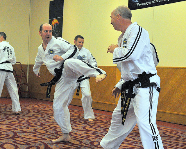 Paul Delea attempts to outflank Denis Gannon's lead leg side kick in a sparring timing drill 